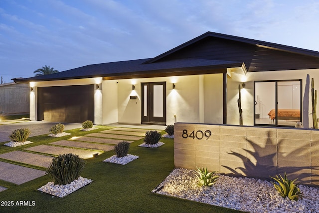 exterior space with a garage and driveway