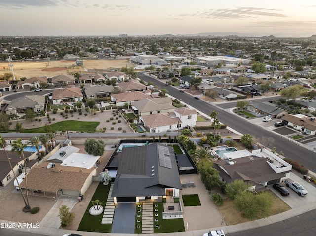 aerial view at dusk with a residential view