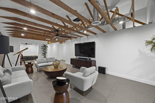 living area with lofted ceiling with beams, tile patterned flooring, baseboards, and a ceiling fan