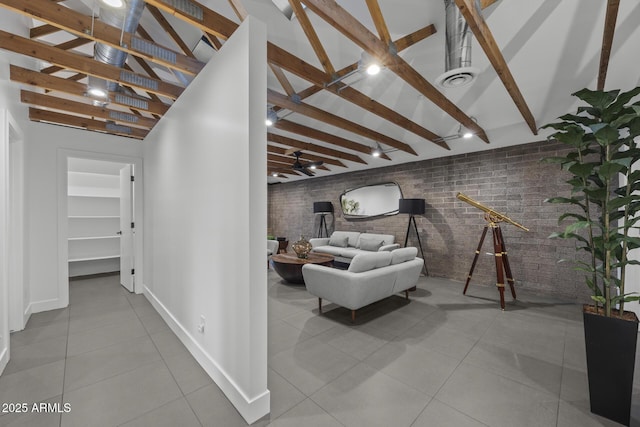 unfurnished living room featuring baseboards, brick wall, tile patterned flooring, high vaulted ceiling, and beam ceiling