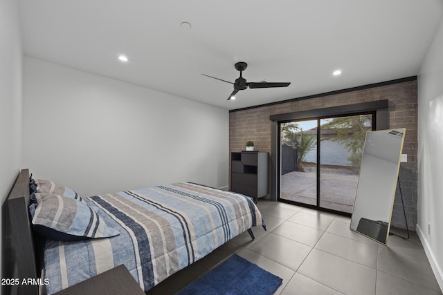 bedroom with ceiling fan, light tile patterned flooring, recessed lighting, brick wall, and access to exterior