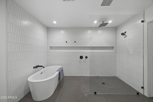 full bath with a soaking tub, tile patterned flooring, visible vents, and walk in shower