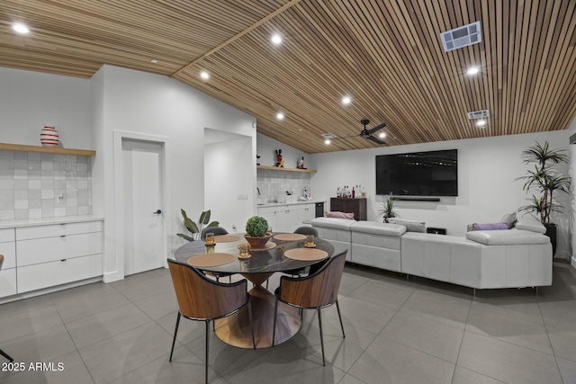 dining area featuring wood ceiling, visible vents, and tile patterned floors