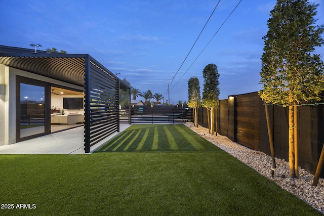 view of yard featuring a patio area and a fenced backyard