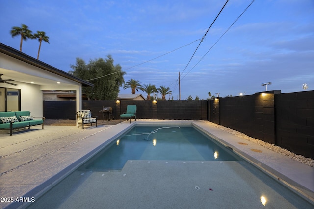 view of pool featuring a patio area, a fenced backyard, and a fenced in pool