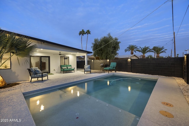 view of pool with a patio area, a fenced backyard, ceiling fan, and a fenced in pool