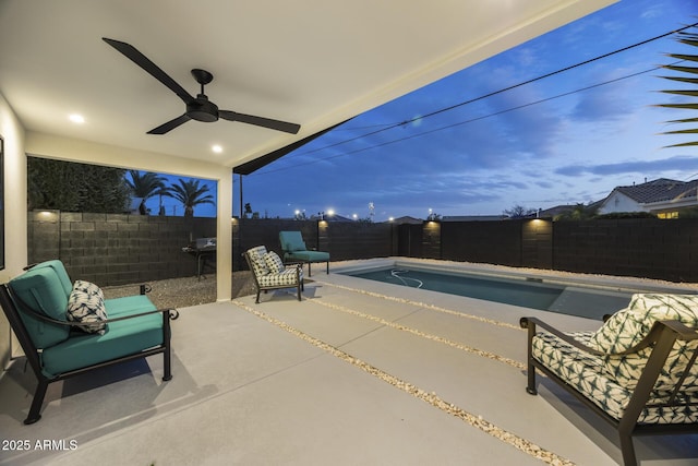 view of patio with a fenced backyard, a ceiling fan, and a fenced in pool