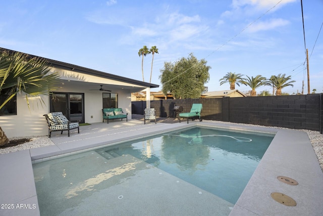 view of pool with a fenced backyard, a fenced in pool, a ceiling fan, and a patio