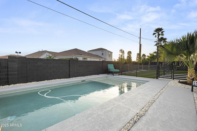 view of pool with a fenced backyard and a fenced in pool