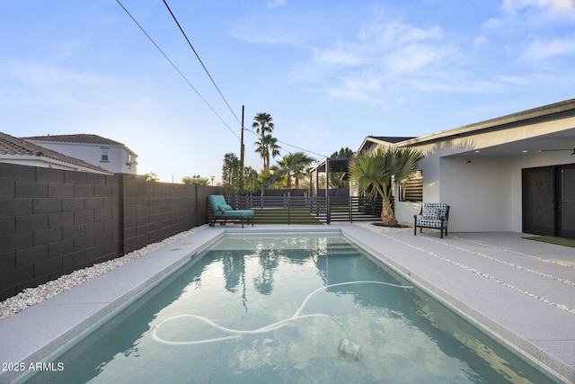 view of swimming pool featuring a fenced in pool and a fenced backyard