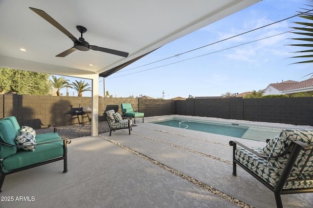 view of pool featuring ceiling fan, a patio, a fenced backyard, and a fenced in pool