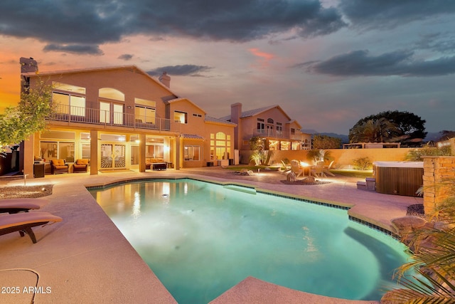 15413 S 31st Pl, Phoenix, AZ 85048 - pool at dusk with outdoor lounge area, a patio, and a fenced in pool
