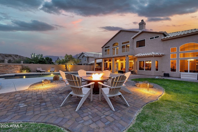 15413 S 31st Pl, Phoenix, AZ 85048 - view of patio featuring a fire pit, fence, and a fenced in pool
