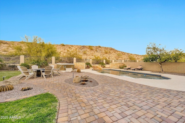 15413 S 31st Pl, Phoenix, AZ 85048 - view of patio / terrace with a fire pit, a mountain view, a fenced backyard, and a fenced in pool