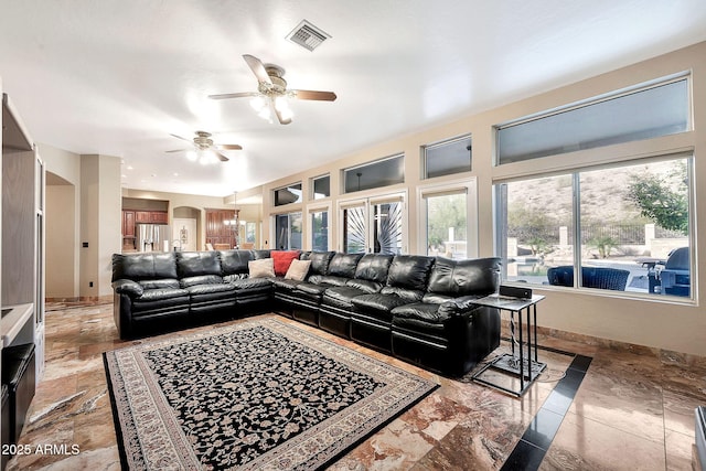 15413 S 31st Pl, Phoenix, AZ 85048 - living room with a healthy amount of sunlight, visible vents, baseboards, and a ceiling fan