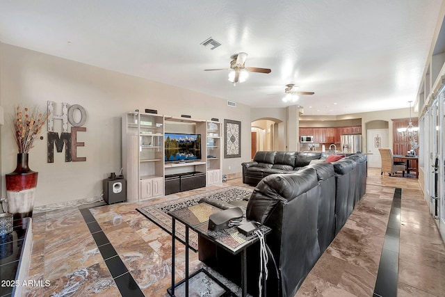 15413 S 31st Pl, Phoenix, AZ 85048 - living room featuring baseboards, visible vents, arched walkways, and ceiling fan