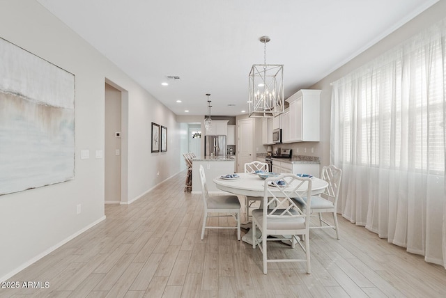 dining space with recessed lighting, a notable chandelier, visible vents, baseboards, and light wood-type flooring