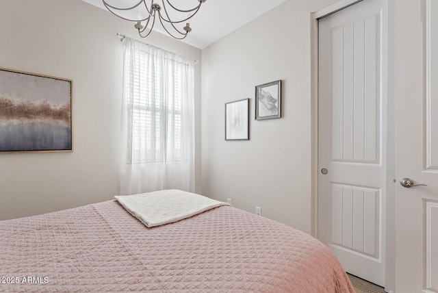 bedroom featuring a chandelier