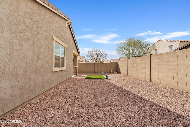 view of yard with a fenced backyard