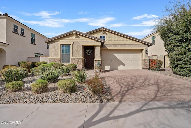 craftsman-style house featuring stone siding, decorative driveway, an attached garage, and stucco siding