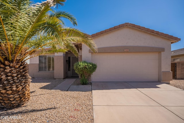 view of front of home featuring a garage, stucco siding, and concrete driveway