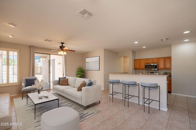 living area with visible vents and recessed lighting