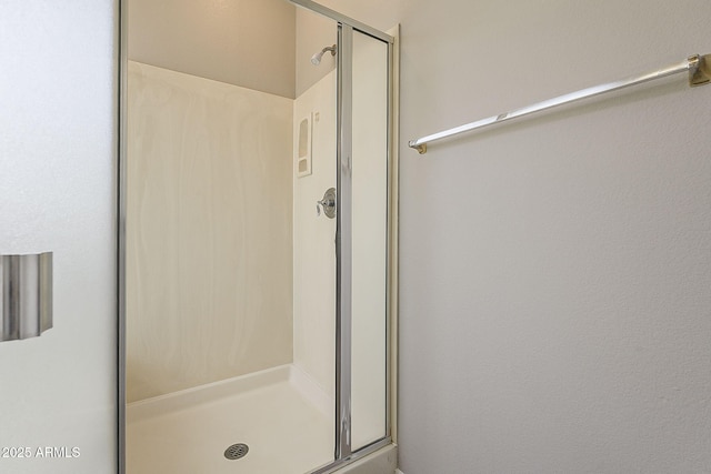 bathroom featuring a stall shower