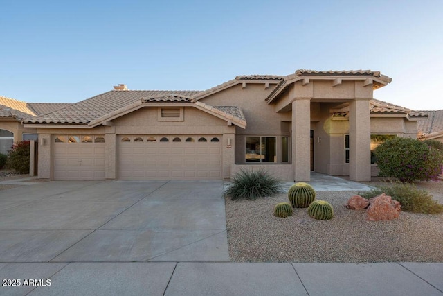 view of front of property with a garage