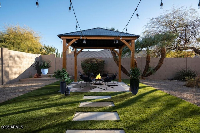 view of yard with a gazebo, a patio area, and a fire pit