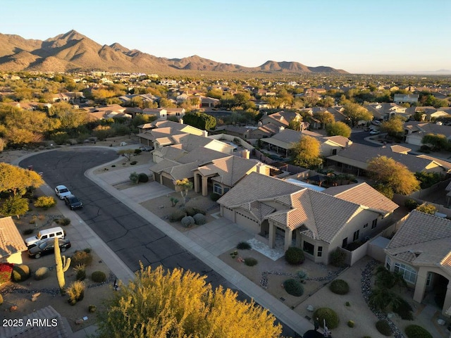 birds eye view of property with a mountain view