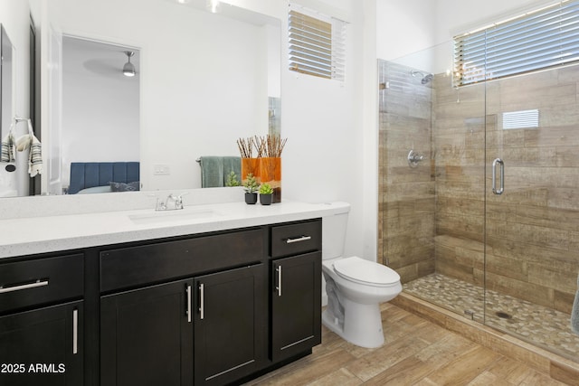 6133 E Dixileta Dr, Cave Creek, AZ 85331 - full bathroom featuring vanity, a stall shower, and wood finished floors