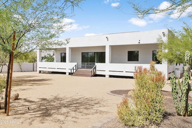 6133 E Dixileta Dr, Cave Creek, AZ 85331 - rear view of property with stucco siding and covered porch