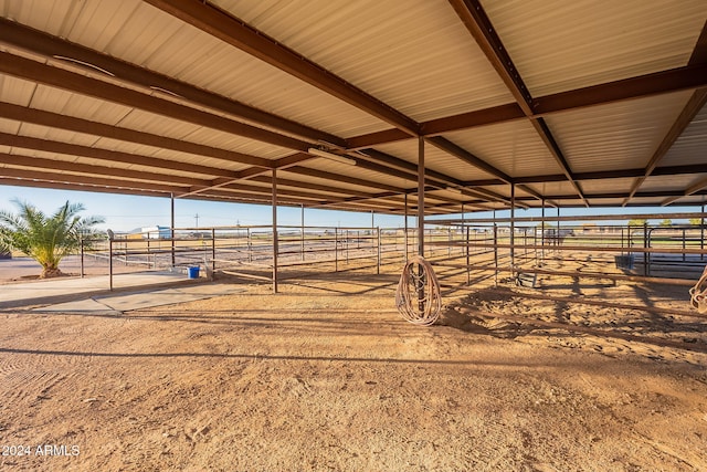 view of stable with a rural view