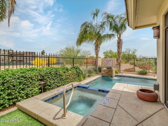 view of swimming pool with an in ground hot tub and pool water feature