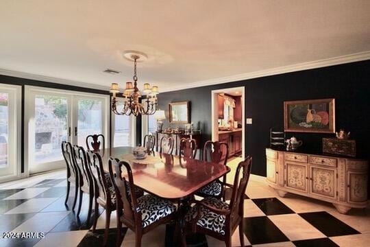 dining area featuring french doors, crown molding, and a notable chandelier