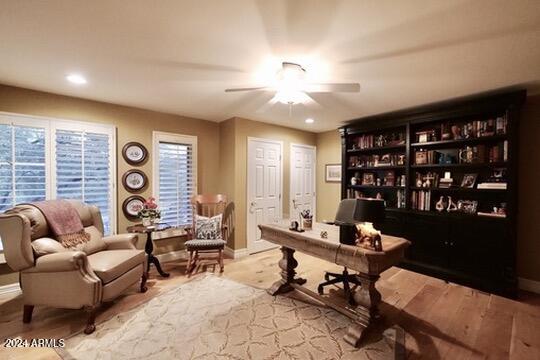 office space featuring light hardwood / wood-style floors and ceiling fan