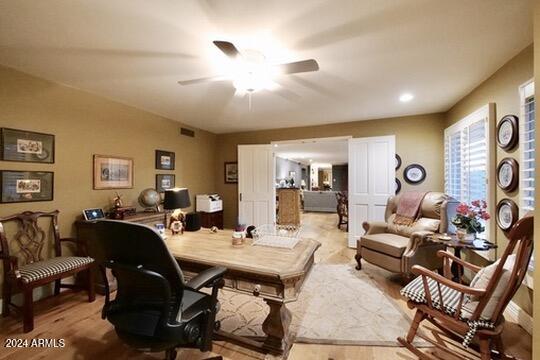 office area with ceiling fan and light wood-type flooring