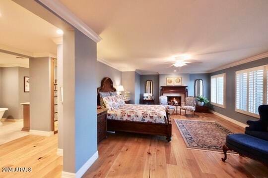 bedroom with ornamental molding, light hardwood / wood-style floors, and ceiling fan