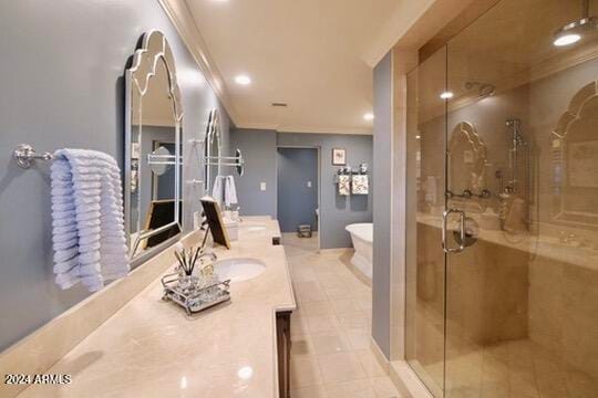 bathroom featuring vanity, ornamental molding, and shower with separate bathtub