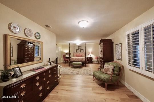 bedroom with light hardwood / wood-style floors