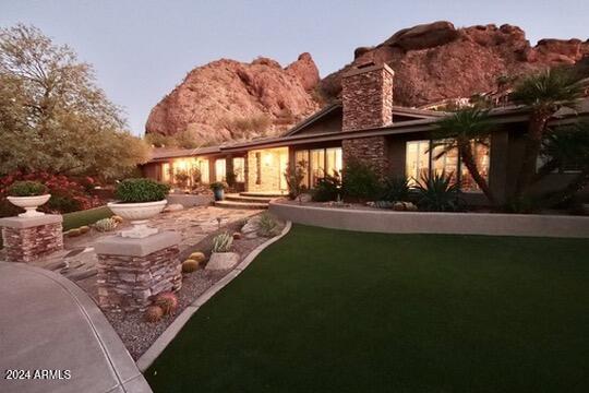 view of front of house featuring a patio area and a mountain view