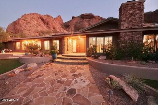 exterior space with a patio area and a mountain view