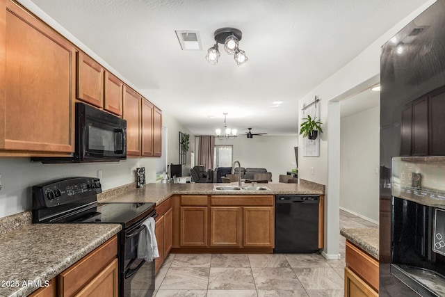 1940 W Expressman St, Apache Junction, AZ 85120 - kitchen featuring black appliances, brown cabinetry, a chandelier, and light marble finish flooring