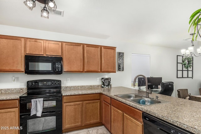 1940 W Expressman St, Apache Junction, AZ 85120 - kitchen with black appliances, light countertops, a peninsula, brown cabinets, and light tile patterned flooring