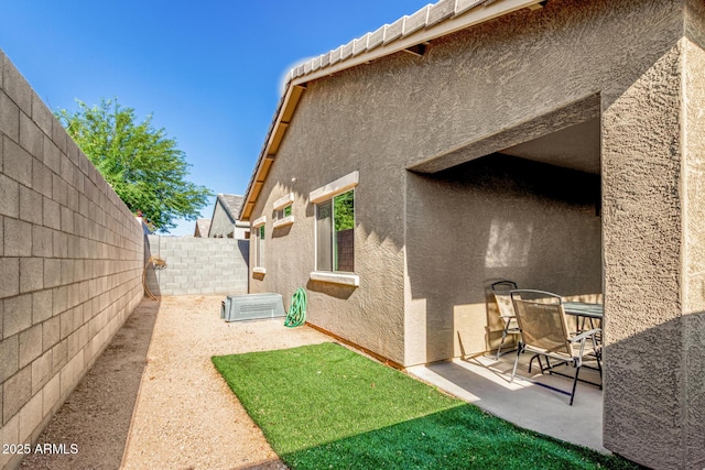 1940 W Expressman St, Apache Junction, AZ 85120 - fenced backyard with a patio area