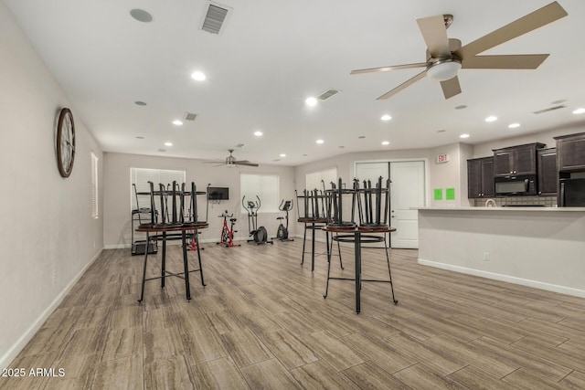 1940 W Expressman St, Apache Junction, AZ 85120 - dining room featuring ceiling fan, light wood finished floors, and recessed lighting