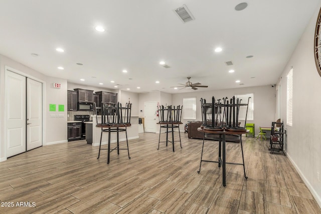 1940 W Expressman St, Apache Junction, AZ 85120 - rec room featuring light wood-style floors, a ceiling fan, and recessed lighting