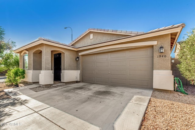 1940 W Expressman St, Apache Junction, AZ 85120 - ranch-style home with stucco siding, driveway, and a garage