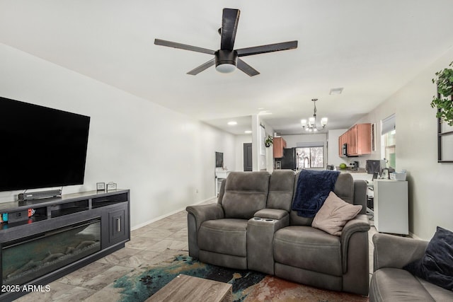 1940 W Expressman St, Apache Junction, AZ 85120 - living area featuring a chandelier, ceiling fan, and light marble finish flooring