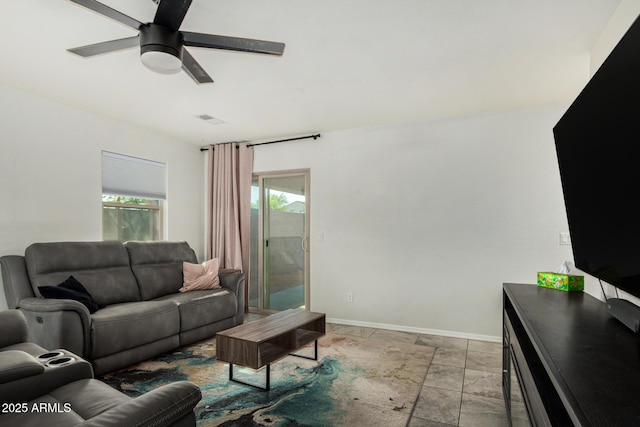 1940 W Expressman St, Apache Junction, AZ 85120 - living room with ceiling fan and baseboards
